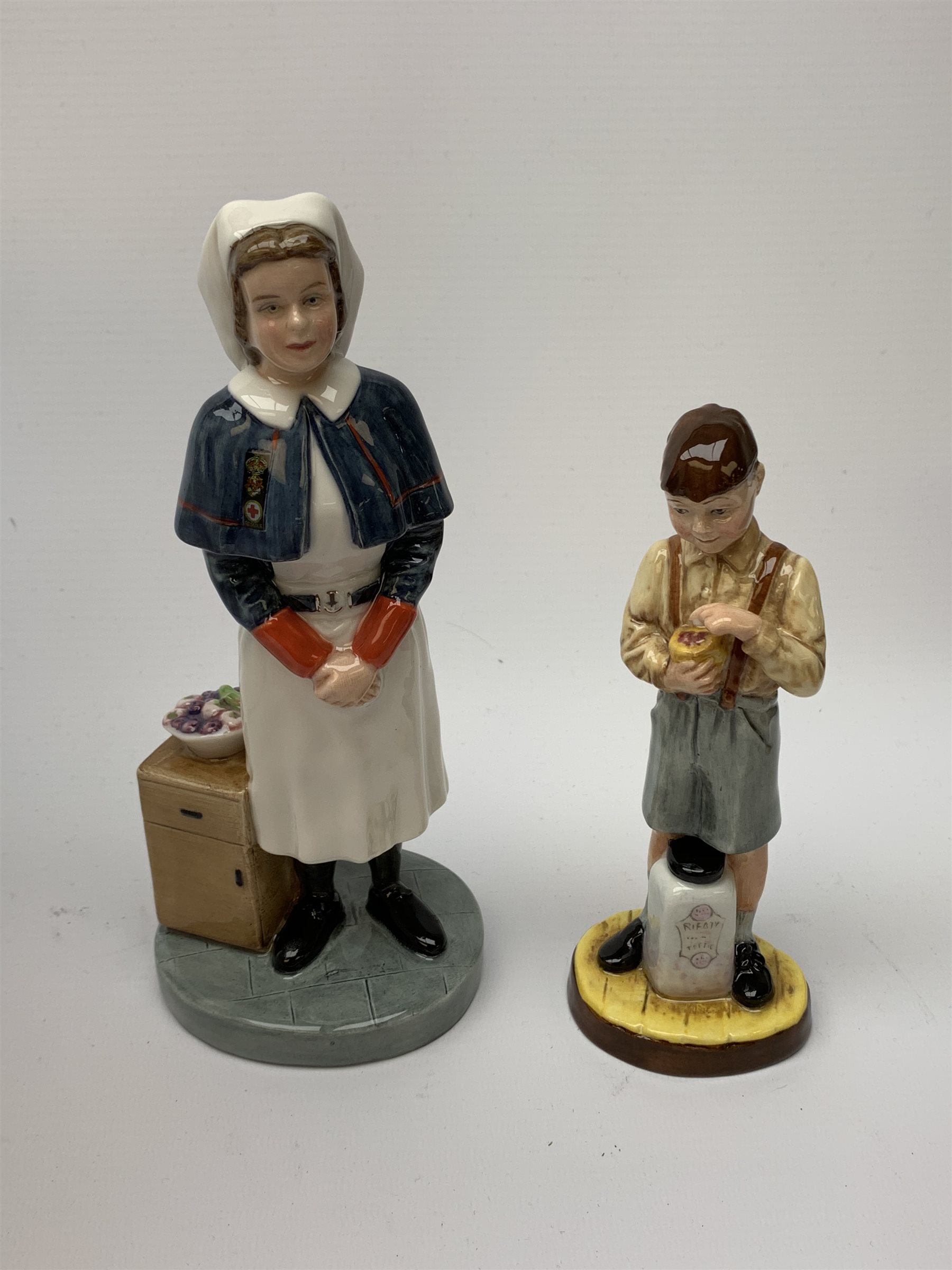 A limited edition Royal Doulton figurine, Queen Alexandra Nurse HN4596, 206/2500, with box and certificate, together with another limited edition Royal Doulton figurine, The End of Sweet Rationing, HN5023, 286/1500, with box and certificate. 