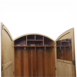 Early 20th century Art Deco bedroom suite, comprising double wardrobe, dressing table and chest of drawers, constructed in walnut with figured veneers and geometric banding, the wardrobe with arched top and panelled doors enclosing a fitted interior, the dressing table with rectangular top below a three panel mirror arrangement, fitted with two short over two long drawers, the chest with three short and three long drawers, each piece fitted with faceted handles and raised on shaped feet
Wardrobe (H 177cm, D 46cm, W 112cm)
Chest (H 85cm, D 48cm, W 92cm)
Dressing table (H 160cm, D 52cm, W 106cm)
