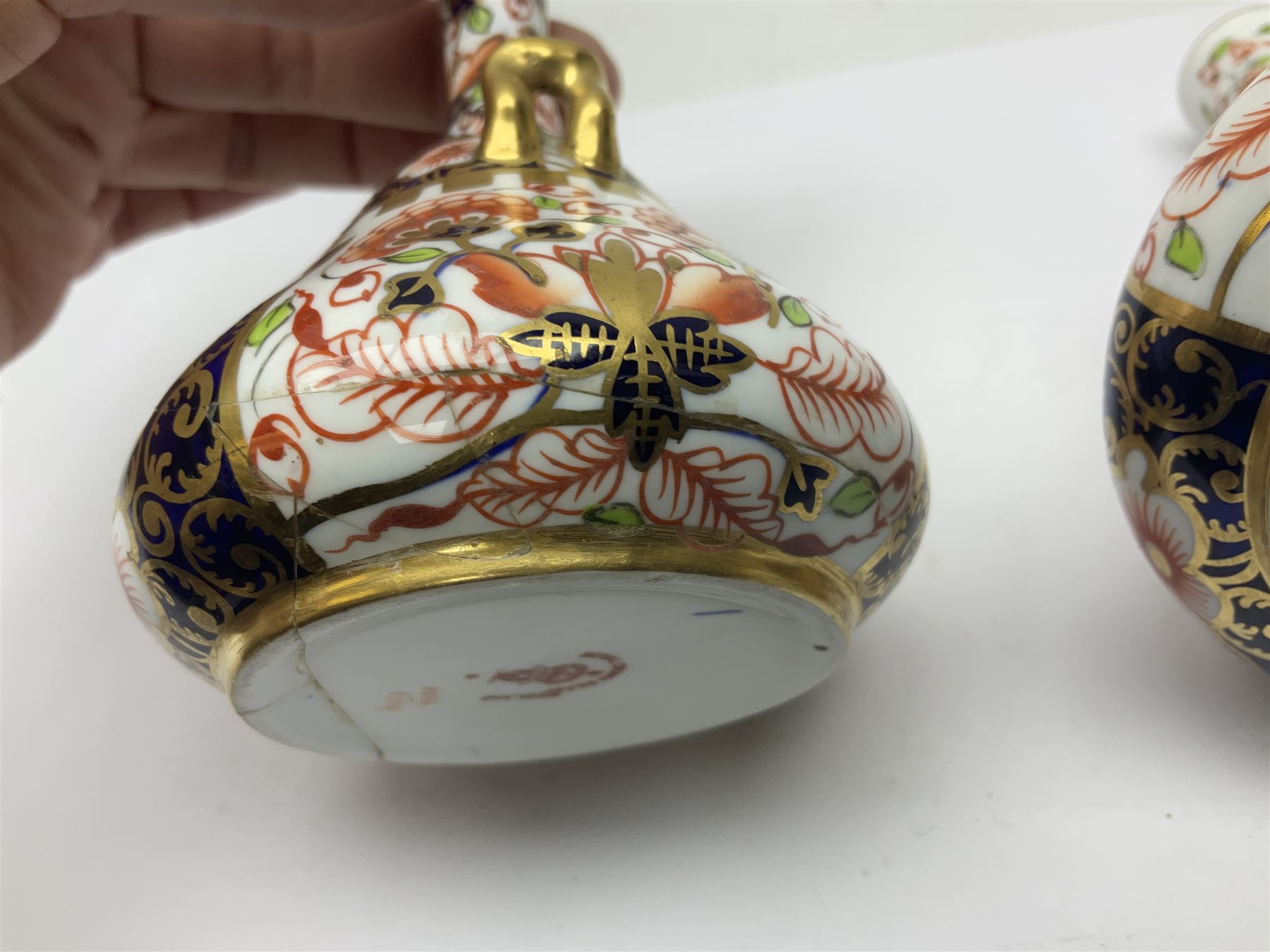 Pair of Royal Crown Derby 6299 imari pattern miniature vases, together with a miniature pitcher and dish in 2451 imari pattern, all with printed marks beneath, vase H12cm 