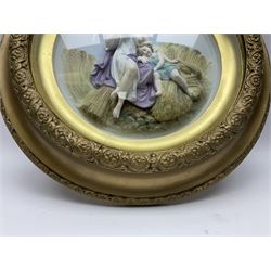 Set of four early 20th century Continental bisque plaques, each of circular form, modelled in high relief as the Four Seasons personified, within gilded circular frames under convex glass, overall D44.5cm