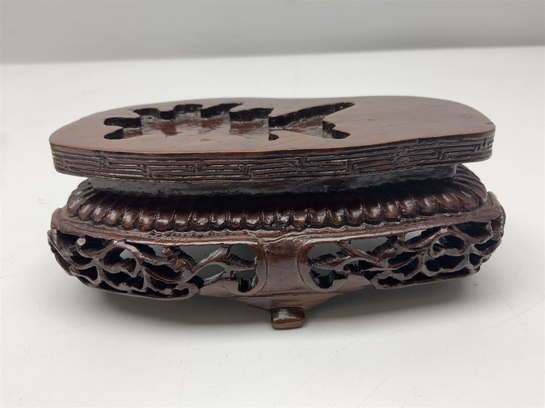 Carved jade figure of a phoenix perched on a flowering branch, upon a wooden stand, with original box, H27cm