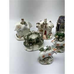 Five Victorian Staffordshire houses, a Coalport example, a Victorian Staffordshire model of a dog kennel with dog and puppy, and four Continental figures, to include a pair of sheep before bocage, each with spurious gold anchor marks. 