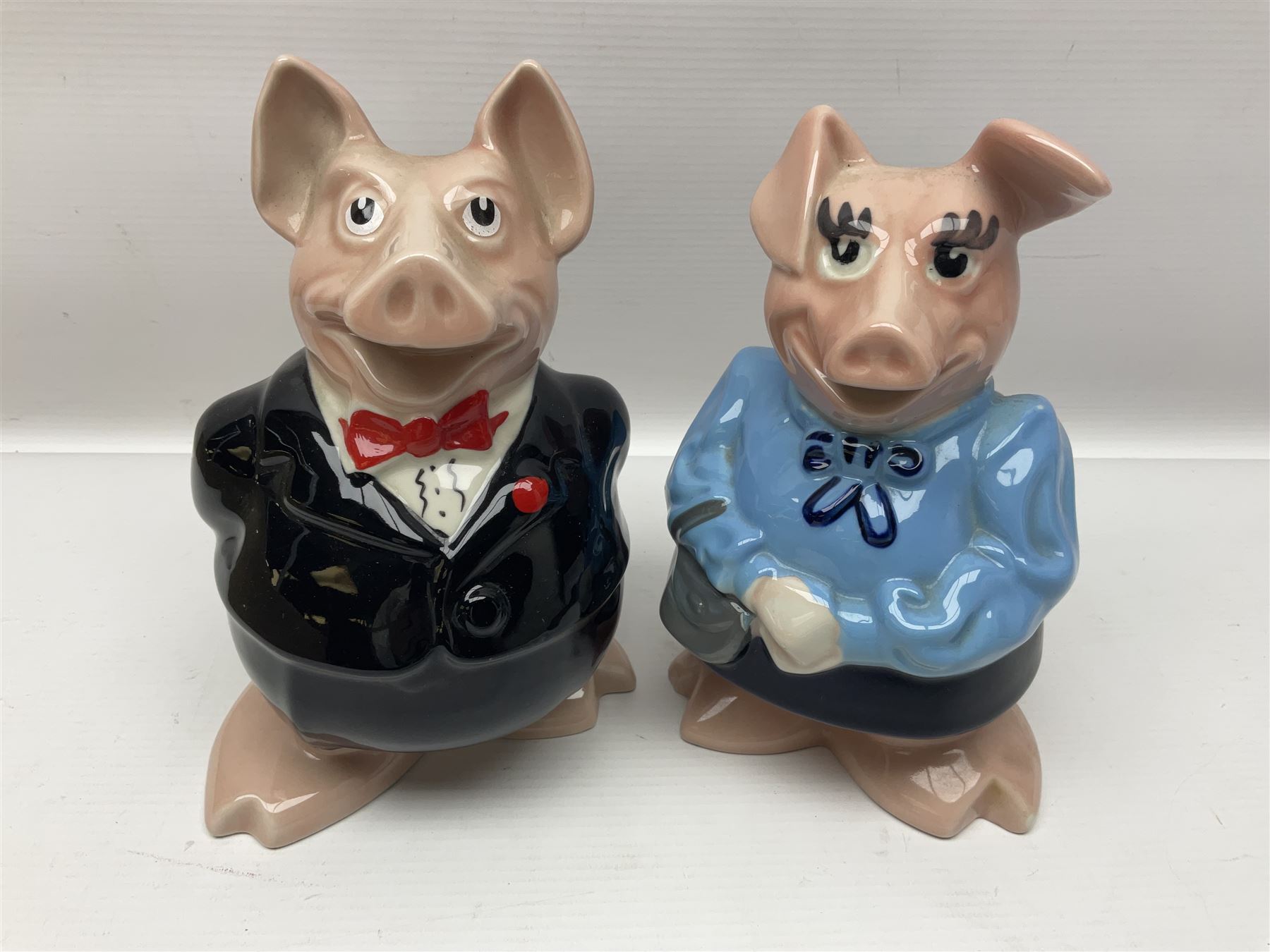 Set of five Wade NatWest money boxes, comprising father, mother, boy, girl and baby