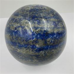 Lapis lazuli sphere upon a carved wooden base 