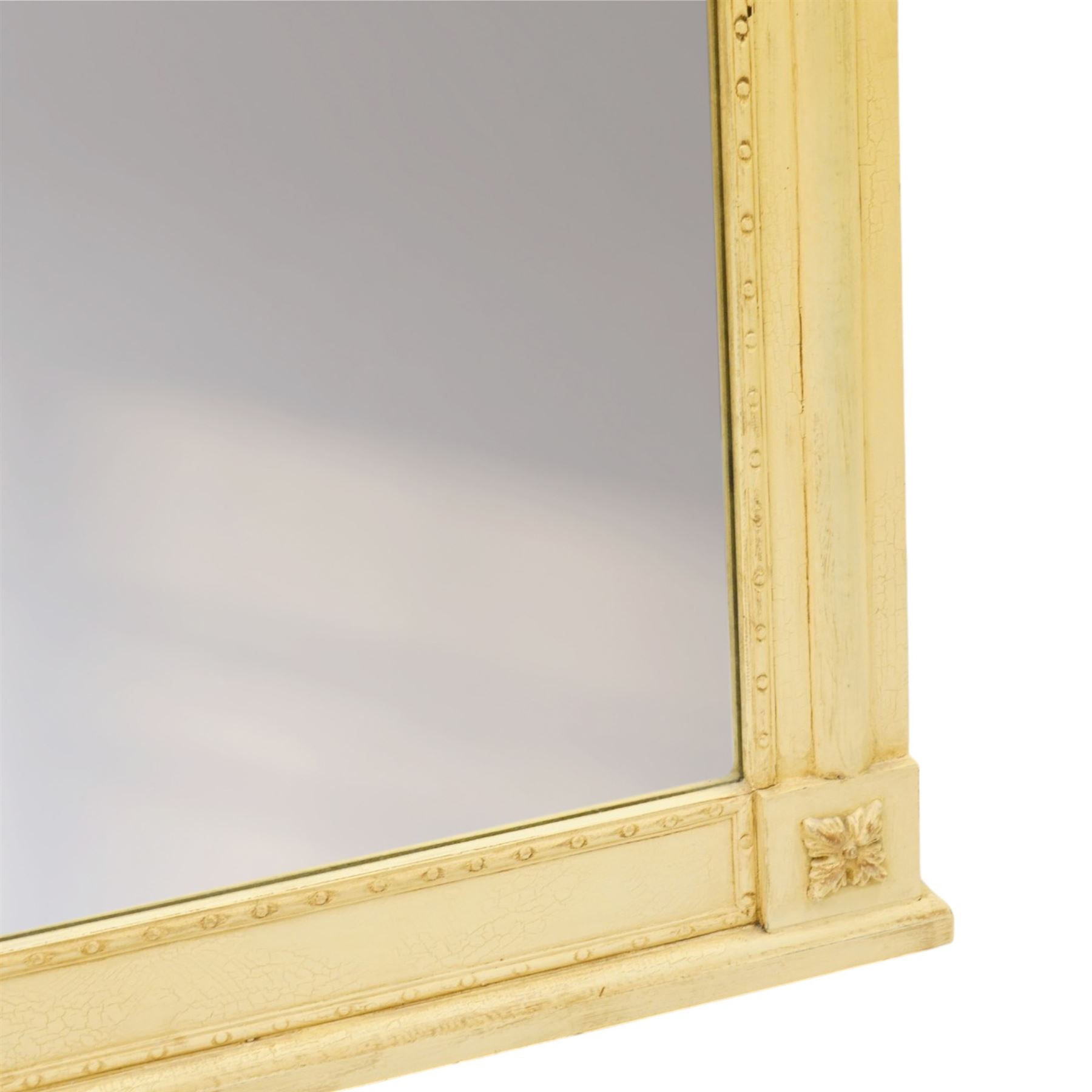 Traditional design cream painted overmantle mirror, projecting cornice with applied foliate detail, bevelled glass plate 