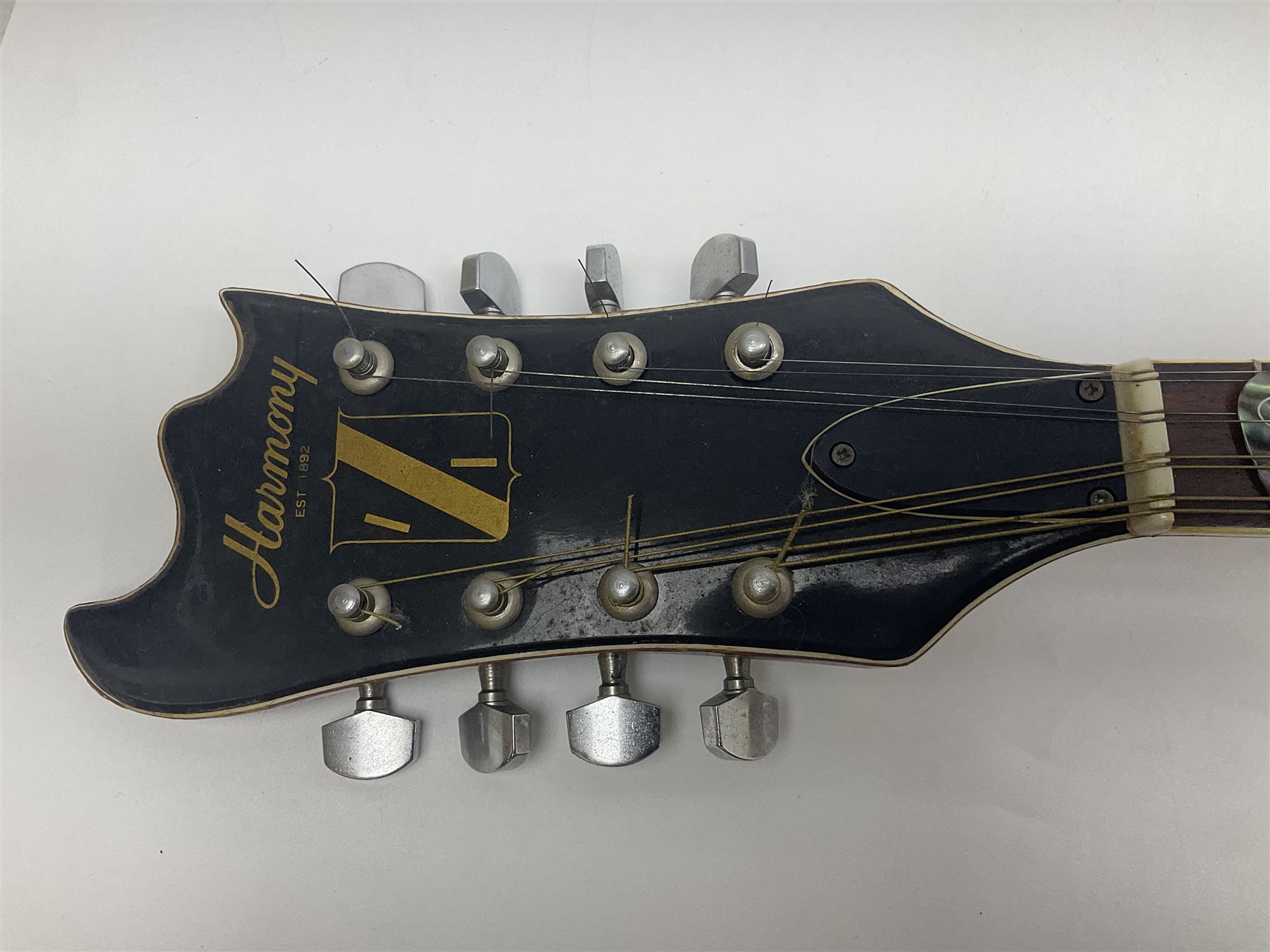 Eastern eight-string mandolin with sunburst finish and mother-of-pearl inlay L68.5cm; and another Harmony mandolin with cracked headstock (2)