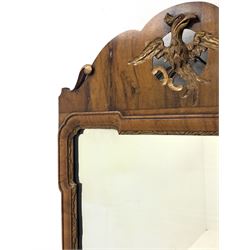 Mid to late 20th century Chippendale style figure walnut mirror, shaped top with carved and pierced gilt ho ho bird motif, moulded framed with gilt inner slip, 46cm x 73cm