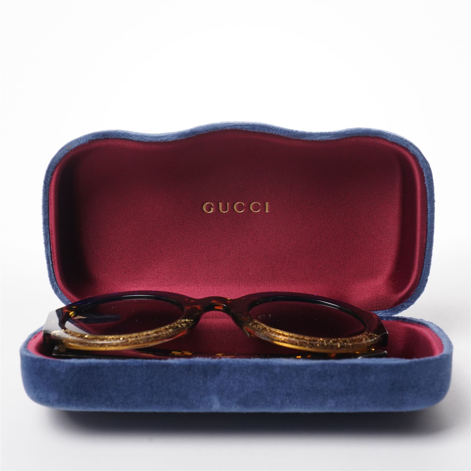 Gucci - pair of oversized round sunglasses, with gradient tinted lenses in a tortoiseshell-effect frame with blue and gold glitter inlay, the temples with interlocking gold-tone GG logo and bee motif, unused with original cloth and hard cases