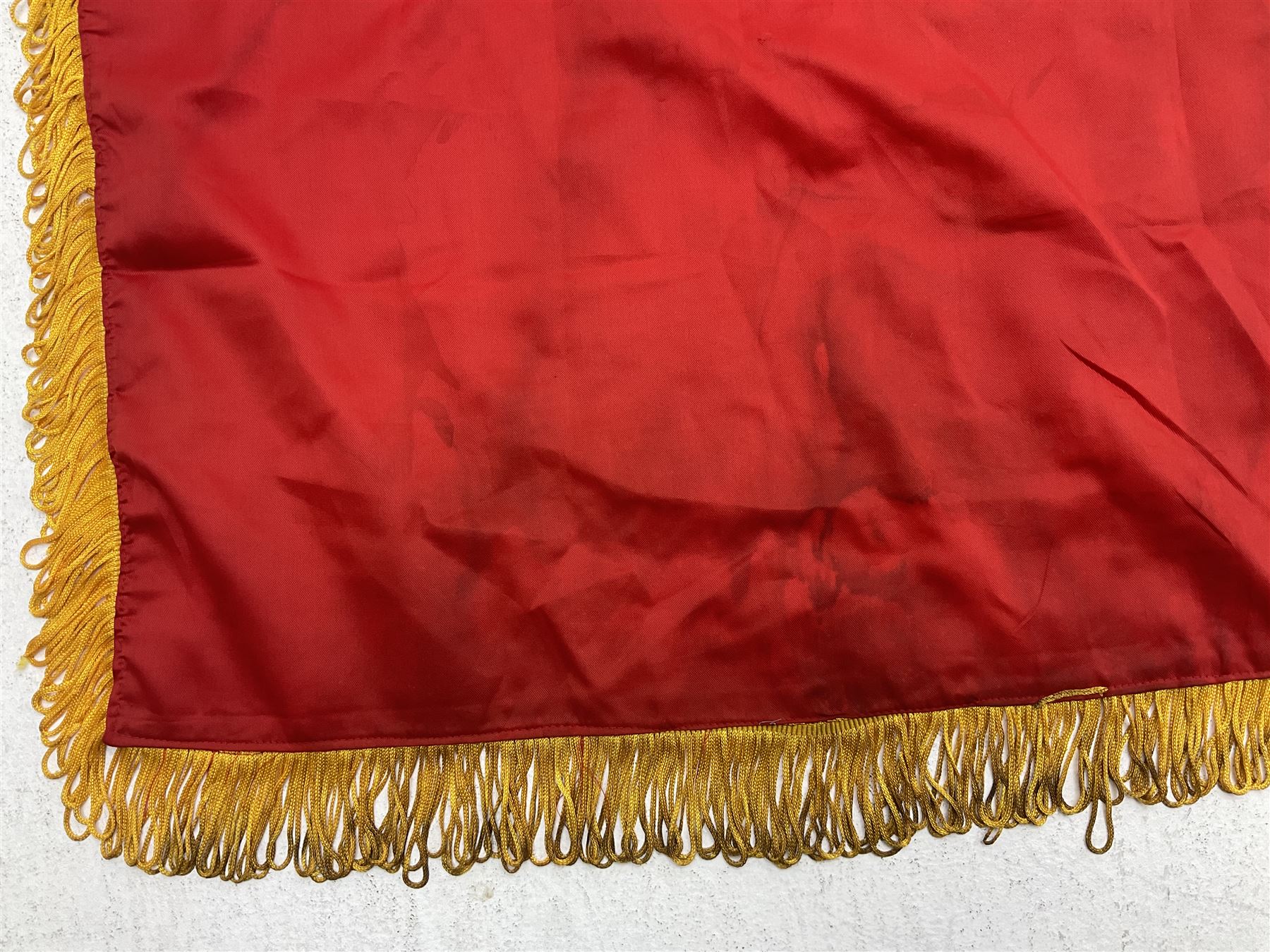 1960s North Vietnam banner embroidered in yellow thread on a red ground, roughly translates as 'Peoples Army of Viet Nam. Warriors of Viet Nam Determined To Keep The Country 1964' around a central military crest with the motto 'Warriors Keep The Country'; tassels to three sides 70 x 100cm