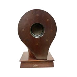 1920's-Aviation clock, mahogany case configured from part of an early 20th century aeroplane propellor, mounted on a conforming plinth with a shaped base, bolt holes filled with brass studs and fitted with an 8-day American spring driven Ansonia insertion movement with a porcelain dial, Arabic numerals, spade hands and seconds dial. Wound and set from the rear.