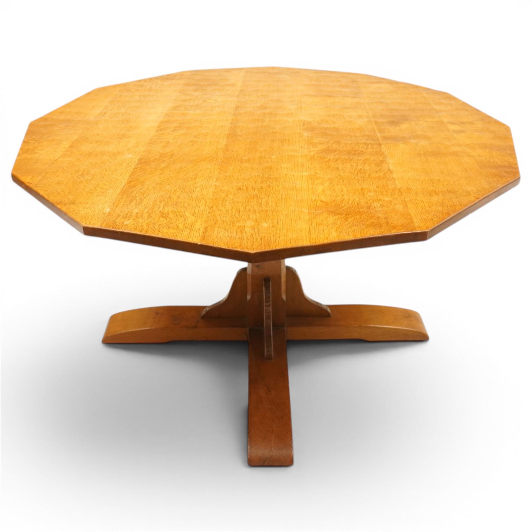 Gnomeman - adzed oak dodecagon dining table, the shaped top raised on a cruciform base with tooled brackets, terminating to four sledge feet, carved with gnome signature, by Thomas Whittaker, Littlebeck, Whitby