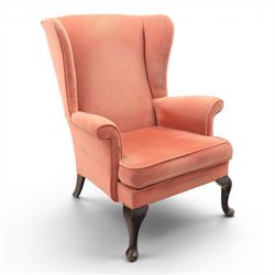 Parker Knoll - mid-century armchair suite, 'Model N30' recliner armchair with headrest and deep buttoned seat and back raised on castors, a wide armchair with deep button back and seat raised on castors, a wingback chair with flared scrolled arms, raised on cabriole supports