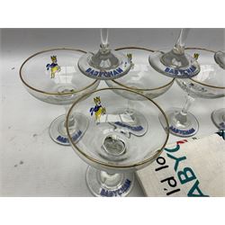 Breweriana; Eight Babycham glasses together with a Babycham plastic fawn mascot and linen I'd Love a Babycham tea towel