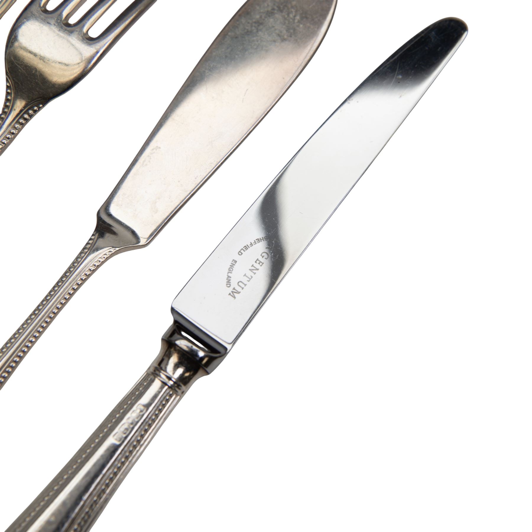 Late 20th century canteen of silver cutlery for twelve place settings, comprising fish knives, fish forks, soup spoons, dessert forks, dessert spoons, silver handled dessert knives, table forks, silver handled table knives, teaspoons, coffee spoons and four table spoons, each with beaded borders to handles, all hallmarked Argentum Ltd, Sheffield 1996, contained within a rectangular mahogany canteen with fitted green velvet interior