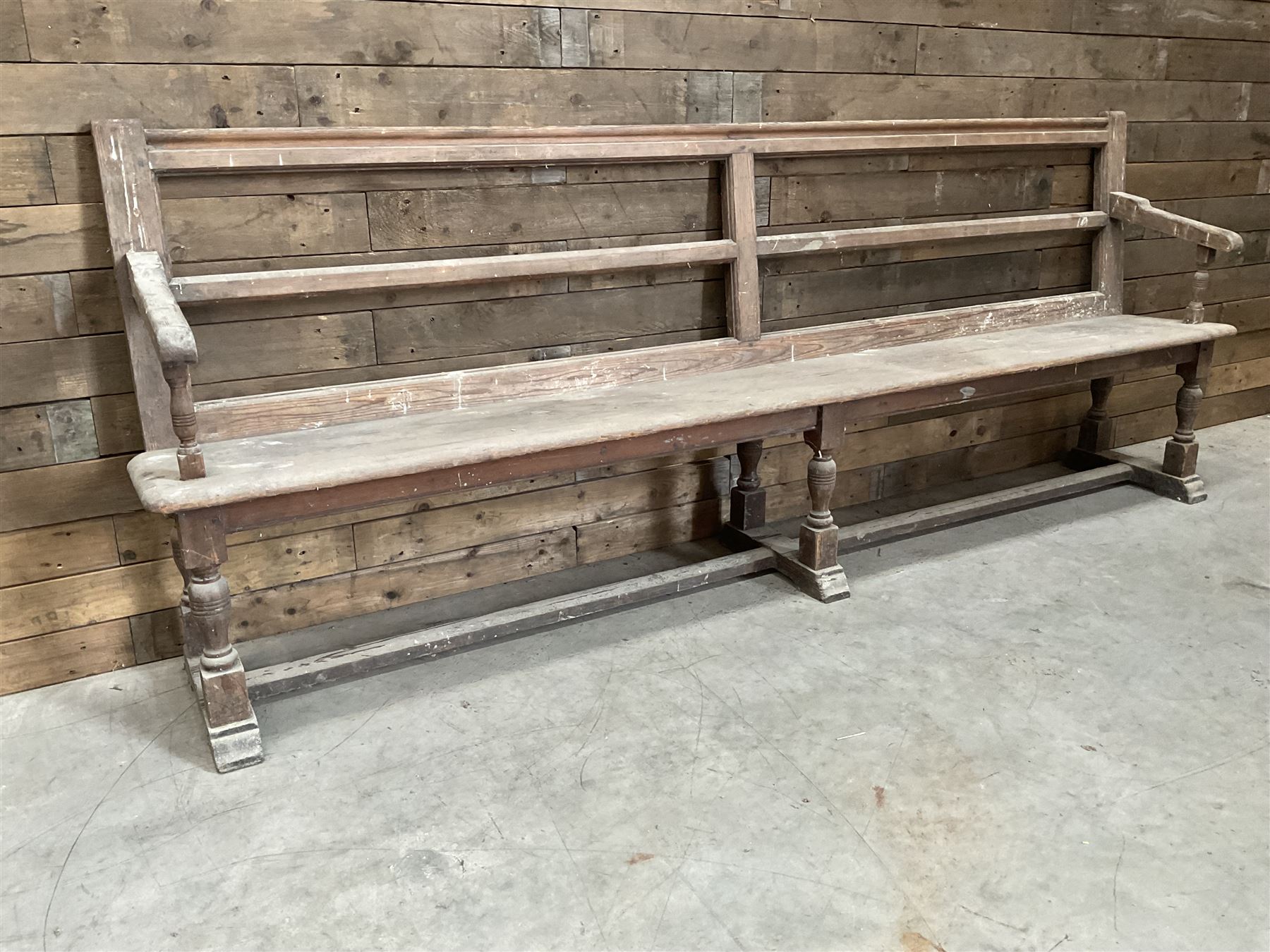Victorian pitch pine bench pew, turned arms and legs, rail back with plank seat, 249cm