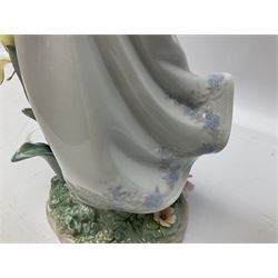 Lladro figure, Mystical Garden, no 6686, modelled as a fairy with flowers in arms, upon a naturalistically modelled base detailed with encrusted flowers, H31cm