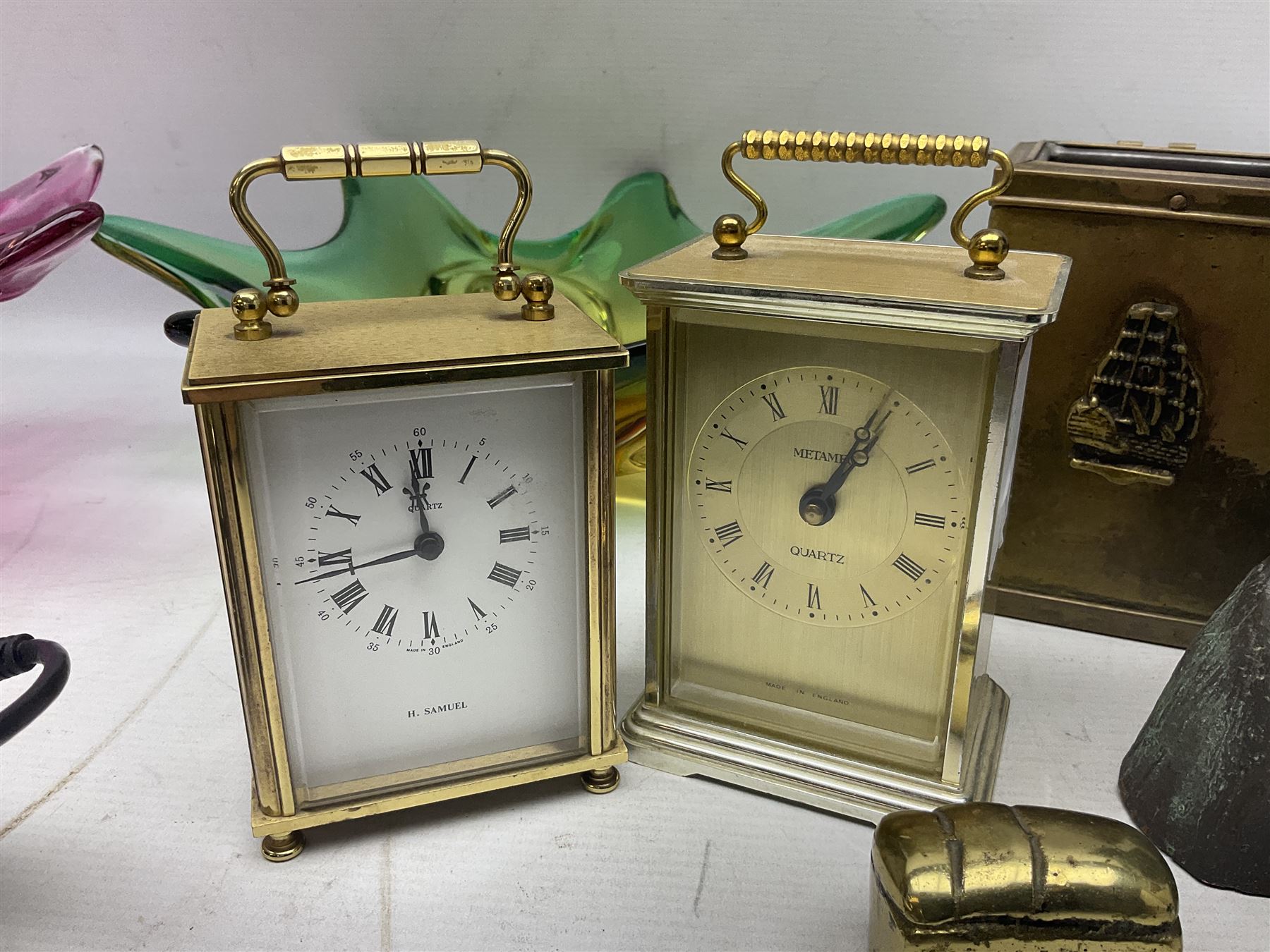 Metamec and H. Samuel battery operated brass carriage clocks, bronzed style abstract figure signed 'Cotp W', two art glass splash bowls, etc