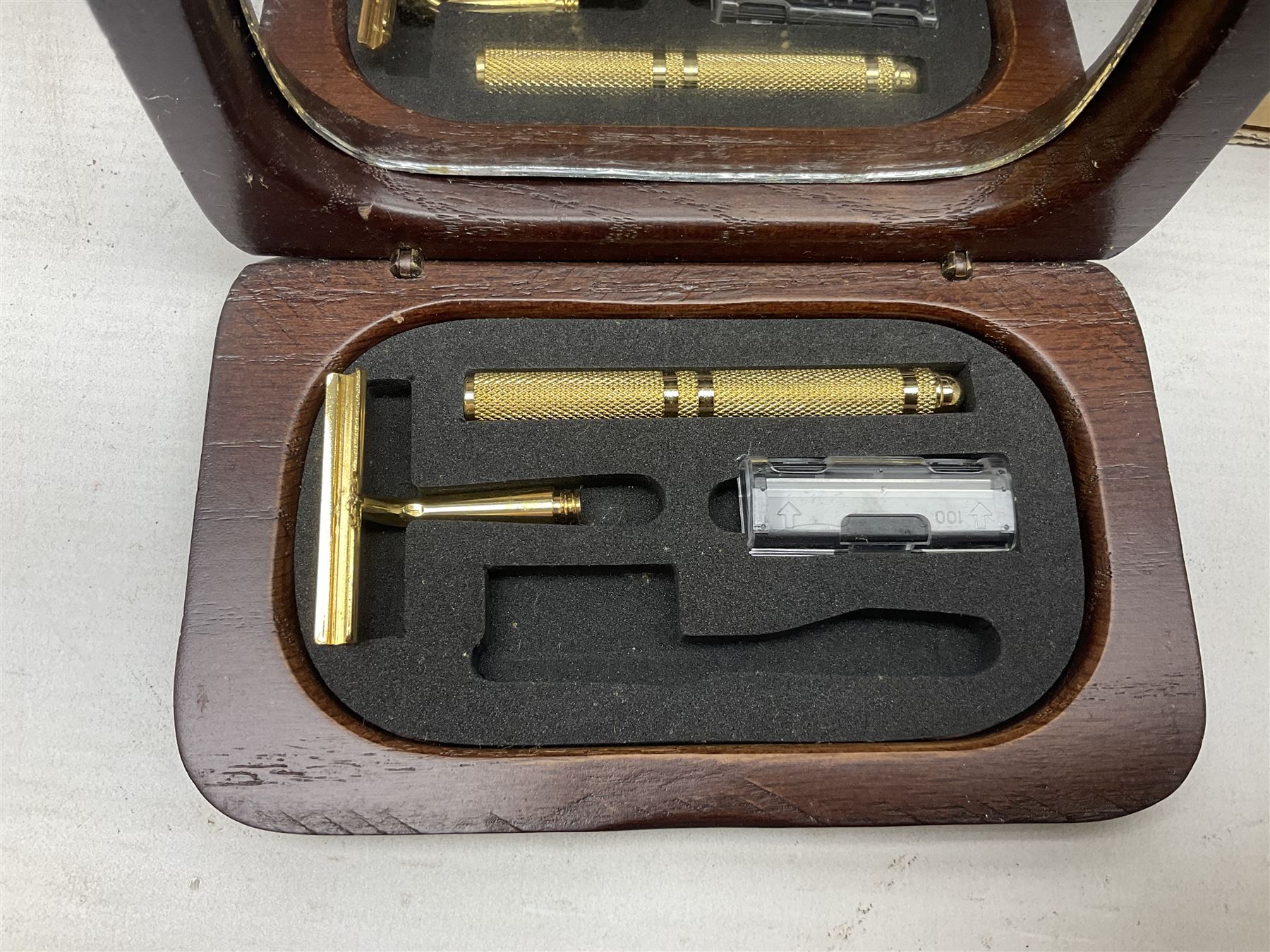 Collection of various razors and smoking items to include Ronson brass table lighter, Rolls Razor, Seigneur case with lighter, etc