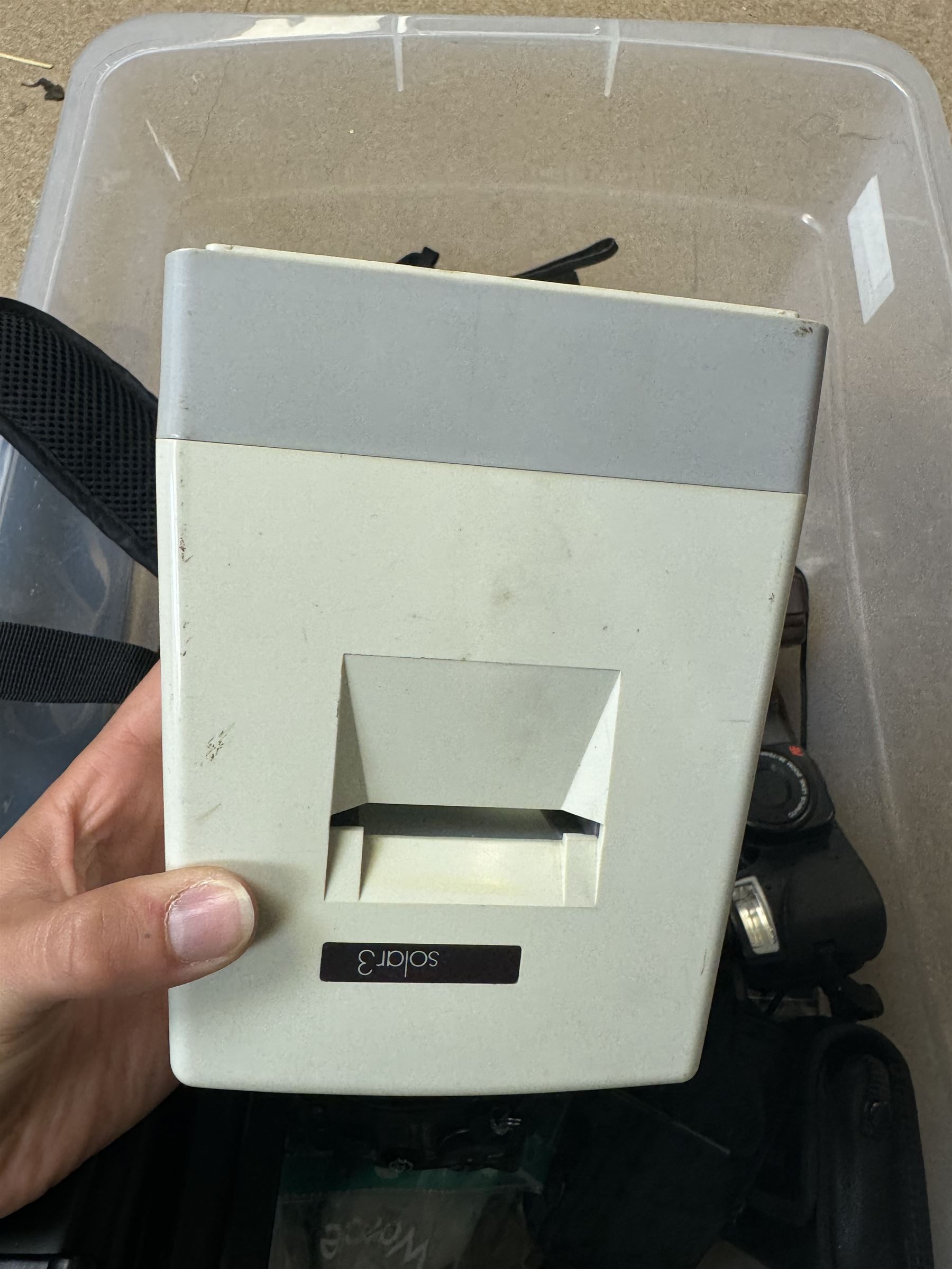 Collection of cameras and camera equipment, including Voigtlander Vitomatic I, Nikon Coolpix P340, Nikon Coolpix S9100, Olympus SP-510UZ, tripod, cases, etc