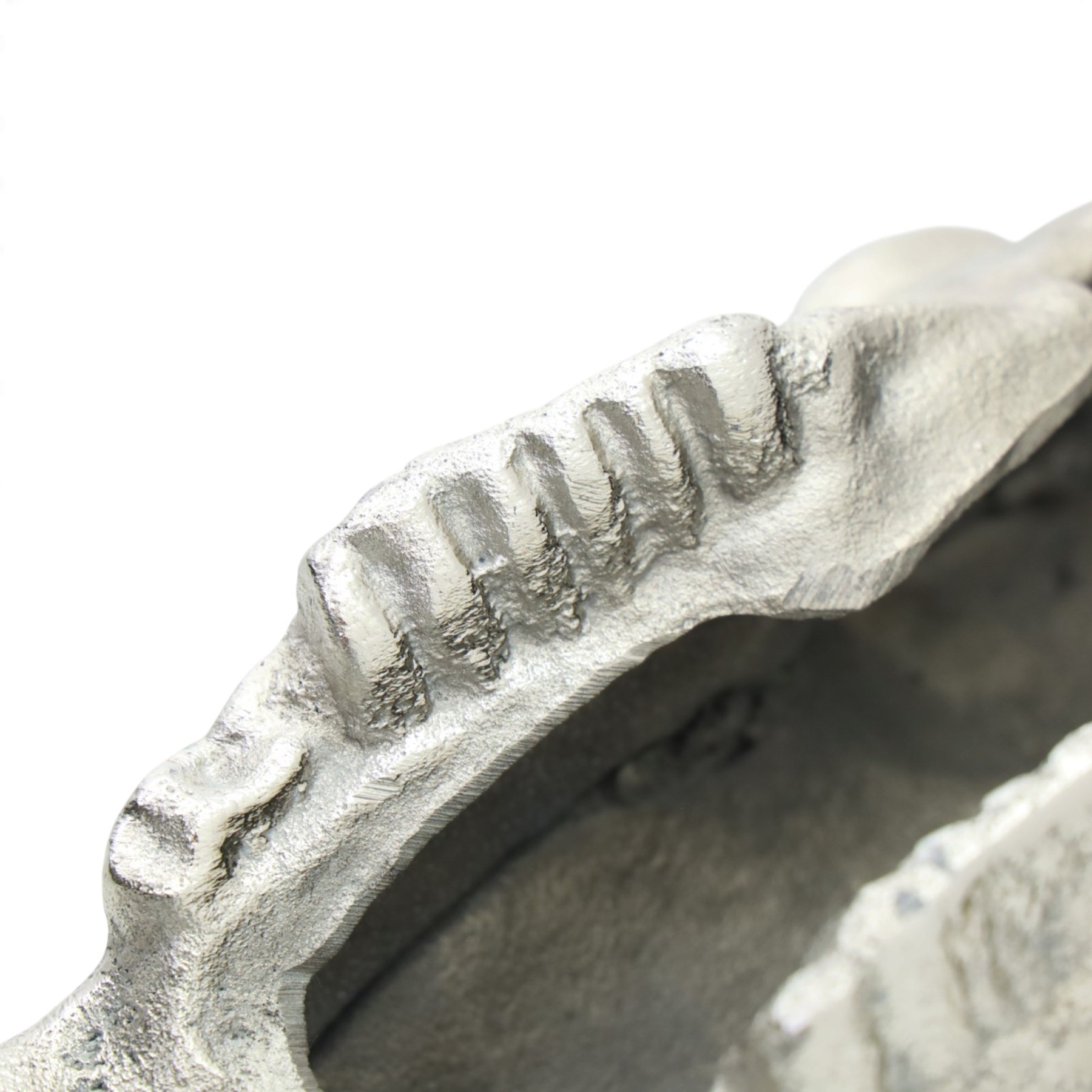 Contemporary cast metal bull skull wall ornament, polished silver finish with textured detailing and outstretched curved horns  