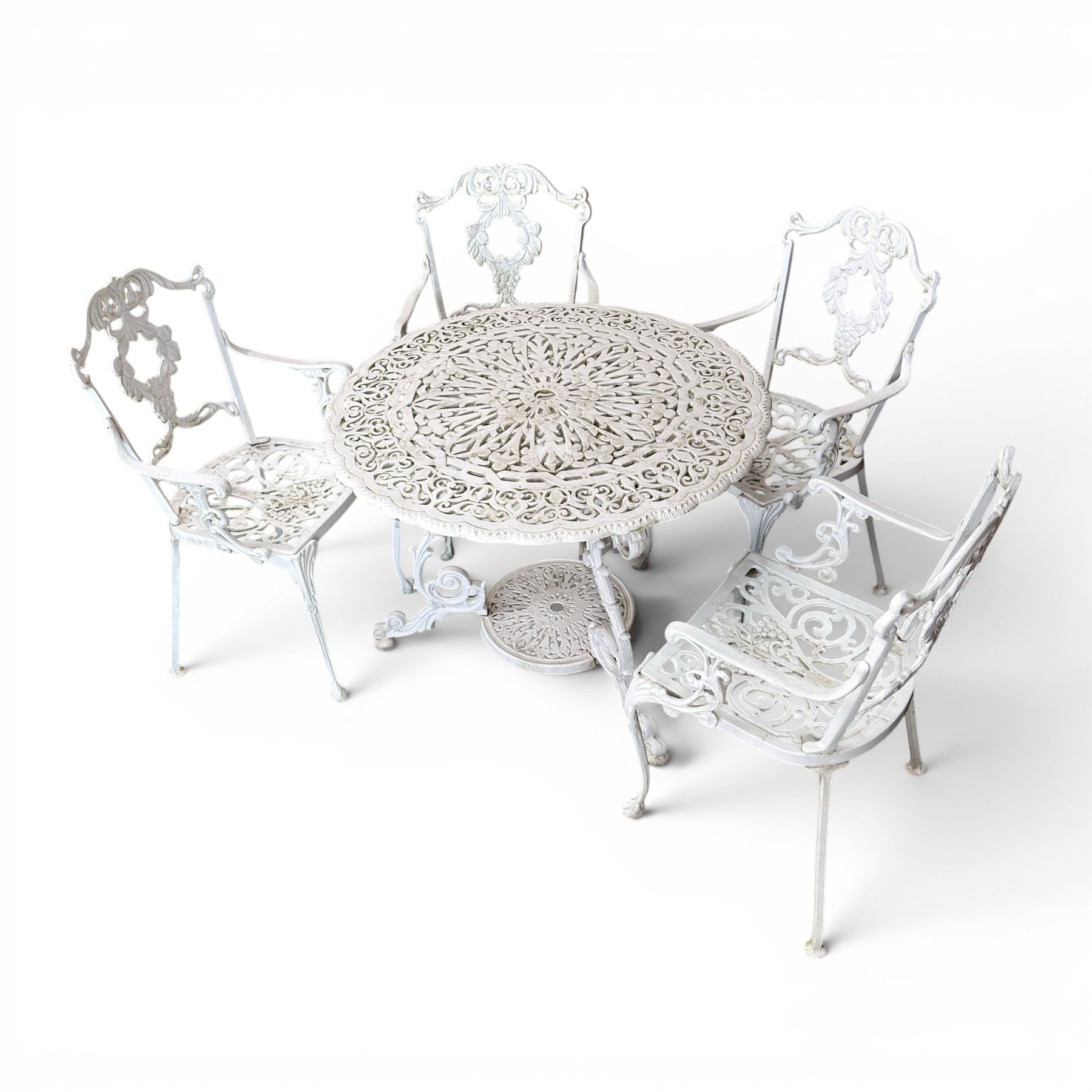 Victorian design cast aluminium circular garden table and four armchairs, ornate grape design in antique white paint