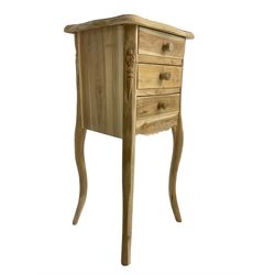 Hardwood bedside lamp table, shaped rectangular top over three drawers, canted uprights with carved floral pattern, shaped apron, raised on cabriole supports