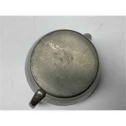 Liberty & Co Tudric pewter three piece tea service, comprising teapot with woven reed handle, twin handled open sucrier, and milk jug, each of squat form with planished finish, each impressed beneath Tudric Pewter Ware 01537 Made in England, together with a matched unmarked tray
