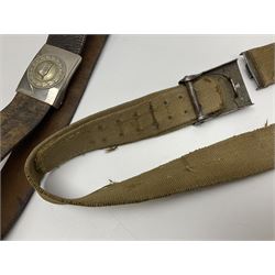 Pair of WW2 German Other Ranks trousers c1940-42, stamped C.& A. Brenninkmeyer Workstatten; WW2 German Army webbing belt with steel 'Gott Mit Uns' buckle; and WW2 German leather belt with 'Stahlhelm' (Steel Helmet League) members buckle (3)