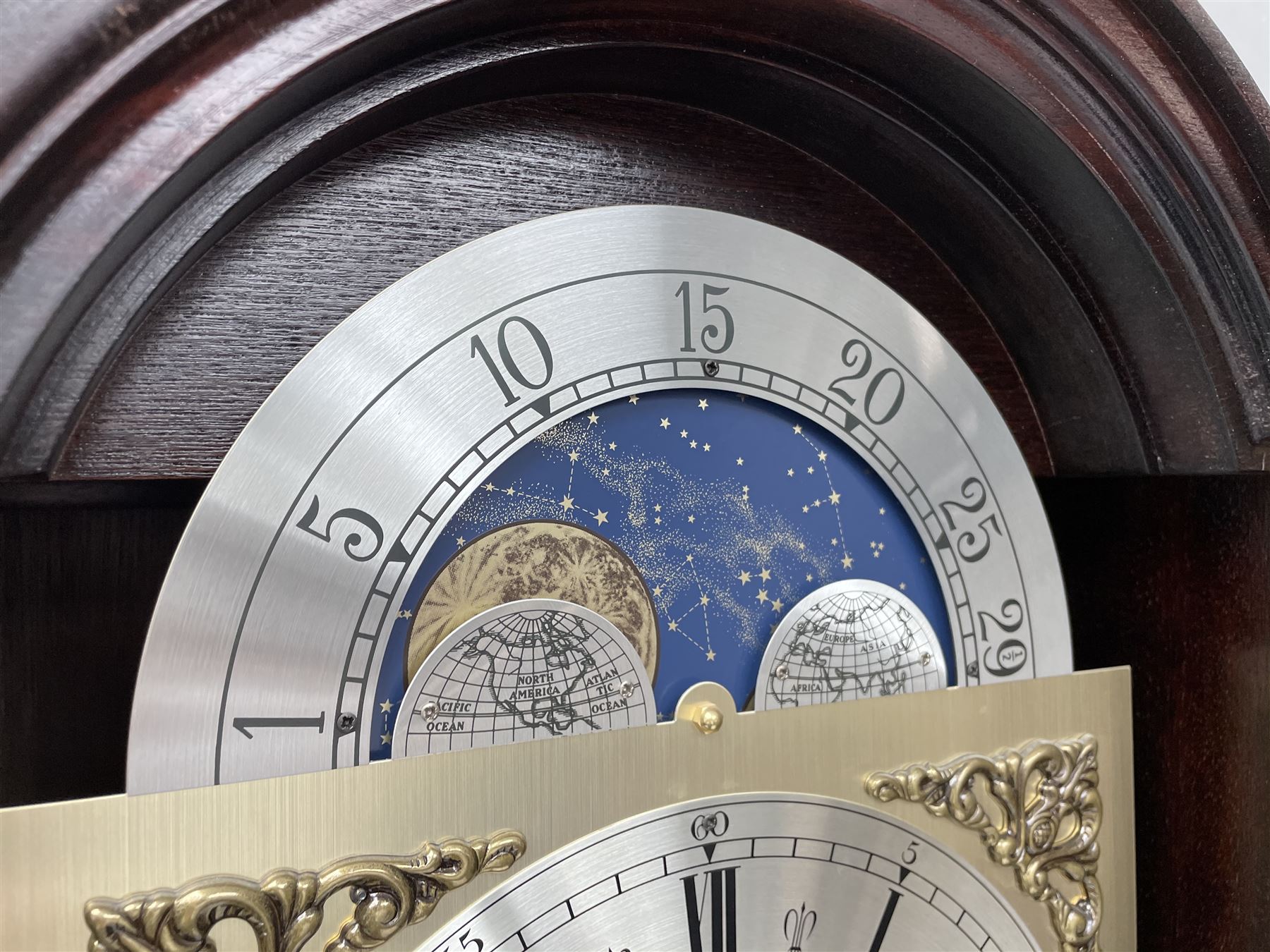 Fenclocks Suffolk - contemporary mahogany longcase clock, stepped arch hood with plain pilaster columns, moon phase dial and silvered Roman chapter ring, with chime set/silent lever, triple weight driven quarter chiming movement