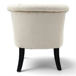 Victorian style upholstered tub chair, buttoned cream fabric back and seat with rolled sides, on ebonised turned front supports with brass castors and splayed rear supports