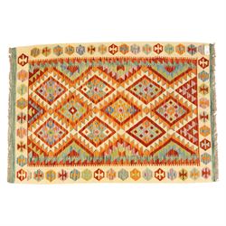 Two Chobi Kilim flatweave rugs, comprising the largest kilim on a cream ground with a grid of stepped diamond medallions in a palette of rust red, turquoise, green, ochre, and lilac,, filled lozenge motifs, framed by a cream ground border, 148x101cm, Chobi Kilim with multi-stepped diamond medallion with serrated bands, in terracotta, turquoise, green, saffron and blue, framed by a broad polychromed border of stylized guls and narrow guard stripes, 114x87cm 