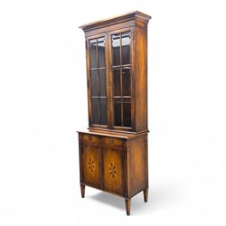 Theodore Alexander - 20th century brass inlaid display cabinet, the upper section with twin astragal glazed doors over a base fitted with two drawers and cupboard doors, decorated with geometric and compass rose marquetry, raised on tapered legs