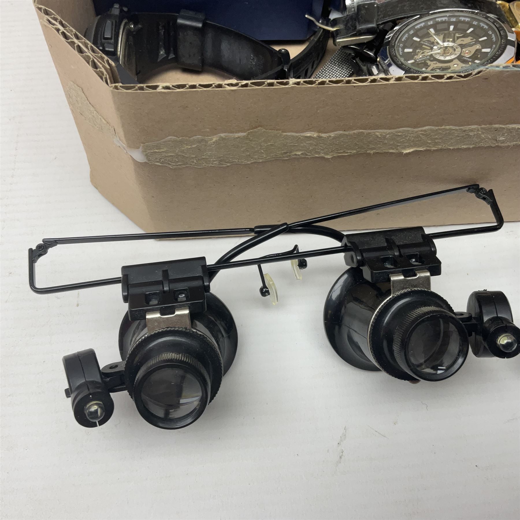 Collection of wristwatches, makers including Bulova and Ingersoll, and some watch makers equipment including glasses, vice and watch back opener