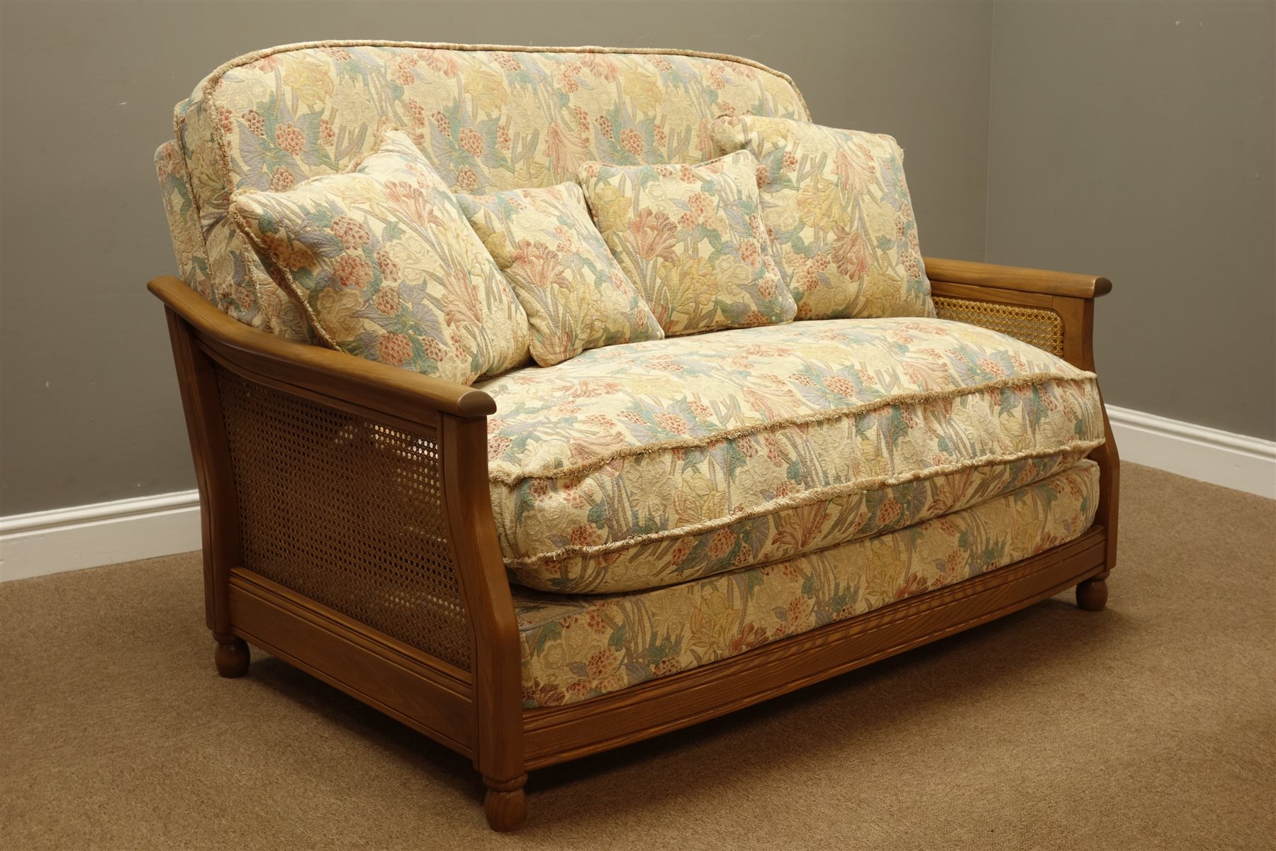 Three piece Ercol bergere lounge suite in golden dawn finish elm four