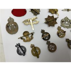Twenty-six cap badges for Yeomanry and various guards including Fife & Forfar, Lothian and Border Horse, Leicestershire, Northamptonshire, Queens Own, Coldstream, Grenadier, Machine Gun Regiment, Life Guards etc (26)