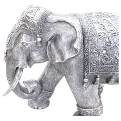 Composite figure of an indian elephant, with a silvered finish, H60cm, L80cm