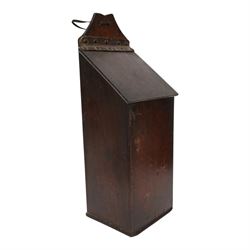 Three George III and later oak candle boxes, the first example of tapering form with shaped and pierced scroll crest, above a hinged lid, H50.5cm W18cm D13cm, the second of plain rectangular form with tapering crest, above a studded leather hinged sloped lid, H46cm W15.5cm D15.5cm, and third of plain rectangular form with demi-lune crest, with lift up front, H42.5cm W17.5cm D12cm 
