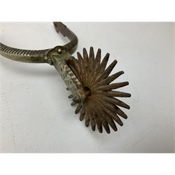 Pair of late 19th century South American iron spurs, engraved silver mounts, with sunburst rowls