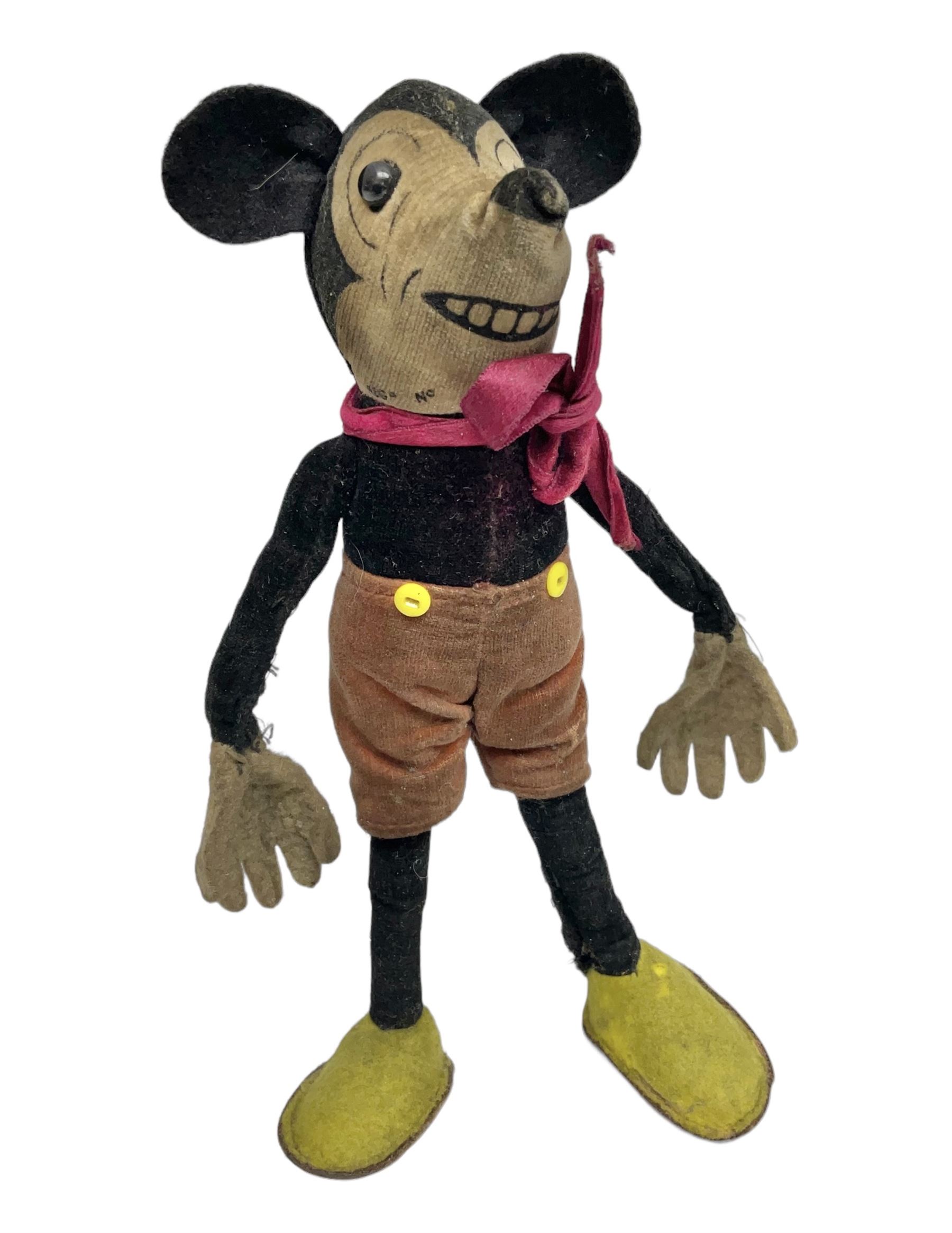 Deans Rag Book Mickey Mouse soft toy, circa 1930's, black velveteen head and body, with cream face and hands, red shorts and yellow felt shoes, marked Reg. No. 750811 to neck H19cm
