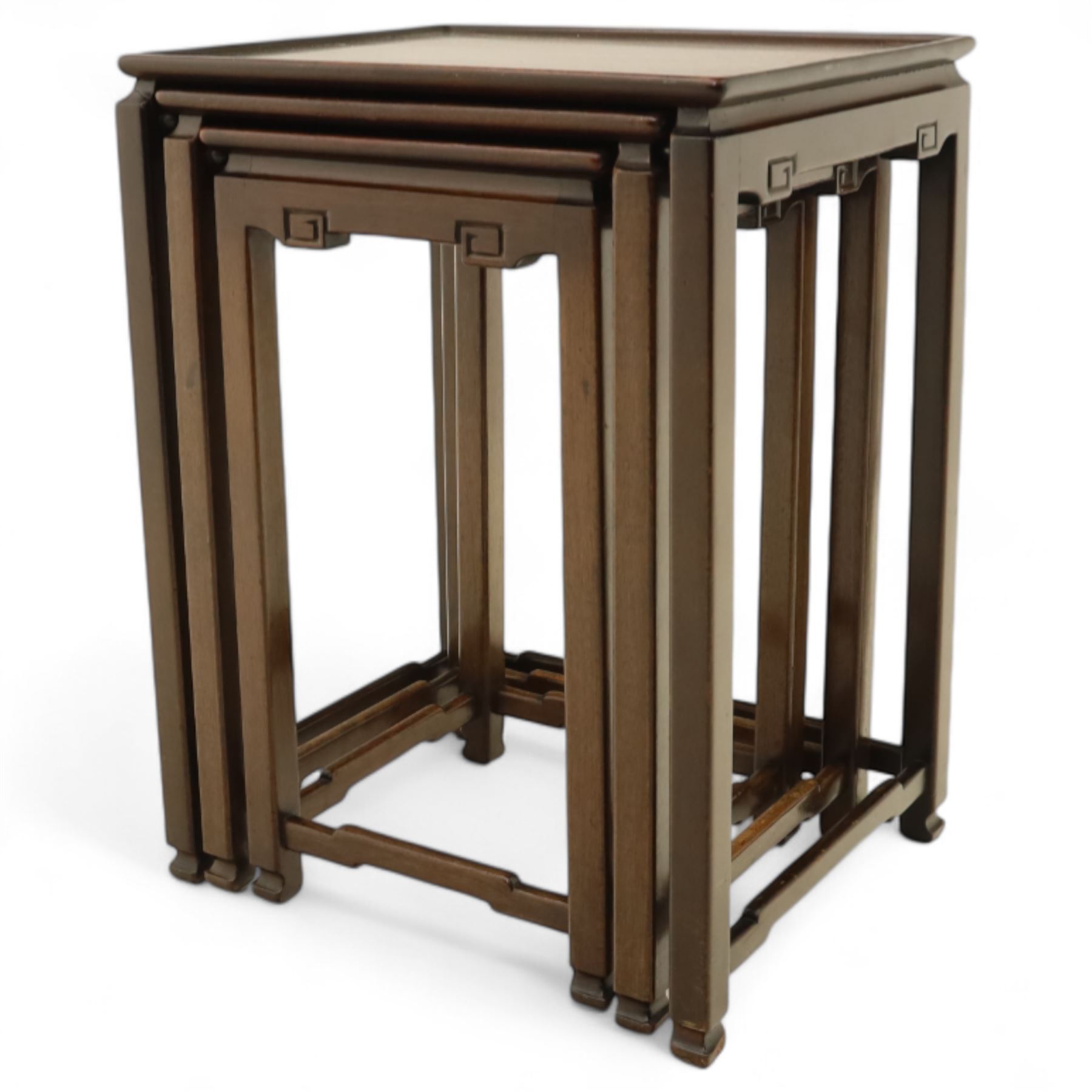 Whytock & Reid, Edinburgh  - Edwardian nest of three Chinese-style solid mahogany occasional tables, rectangular top with finely moulded edge above slim square section legs with subtly chamfered inner edges, joined by H-shaped stretchers, largest W40xD33xH52cm