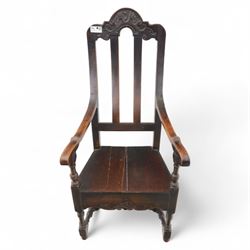 18th century oak provincial armchair, arched and carved cresting rail above triple splat back, shaped arms on turned supports, stuff-over seat upholstered in damask fabric, carved front frieze on turned legs united by stretchers