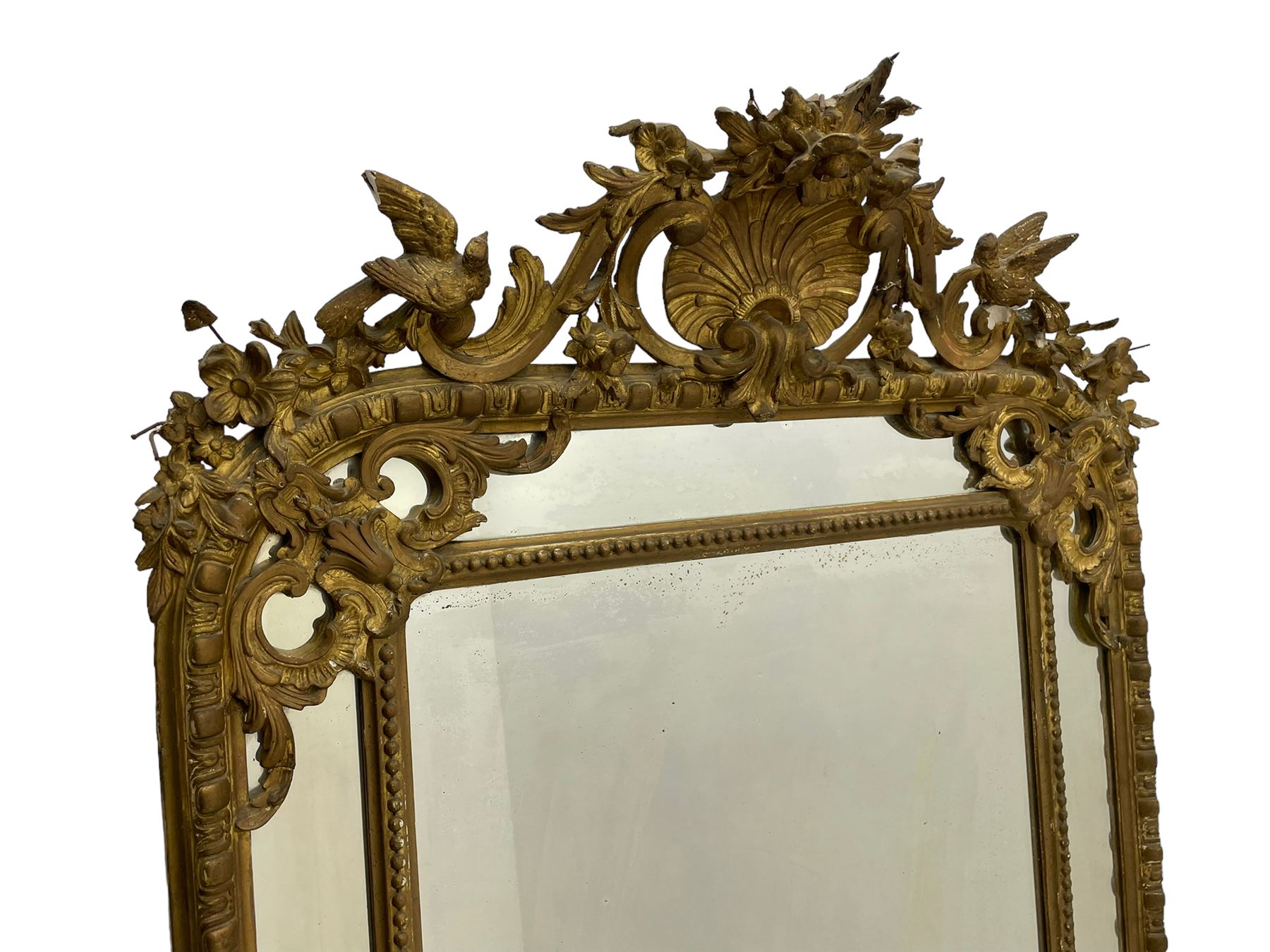 19th century giltwood and gesso pier mirror, shell cartouche pediment decorated with flower heads and scrolling foliage, two bird motifs to each side, egg and dart moulded frame with beaded inner slip, plain mirror plate, each corner mounted by scrolled acanthus leaves and cartouches