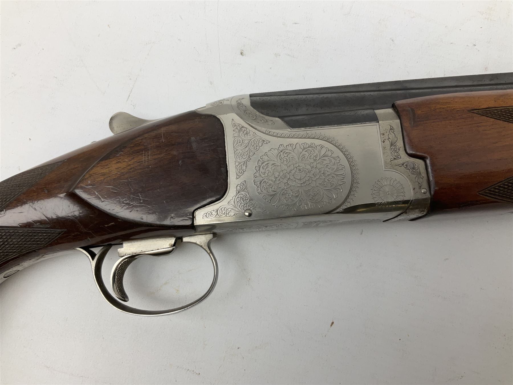 Winchester Japan 5500 12-bore by two-and-three quarters over-and-under double barrel boxlock ejector sporting gun, with 71cm barrels, ventilated rib and barrels, the walnut stock with chequered pistol grip and fore-end, single selective trigger and top safety, serial no.K542927E, L115cm overall; in gun sling SHOTGUN CERTIFICATE REQUIRED