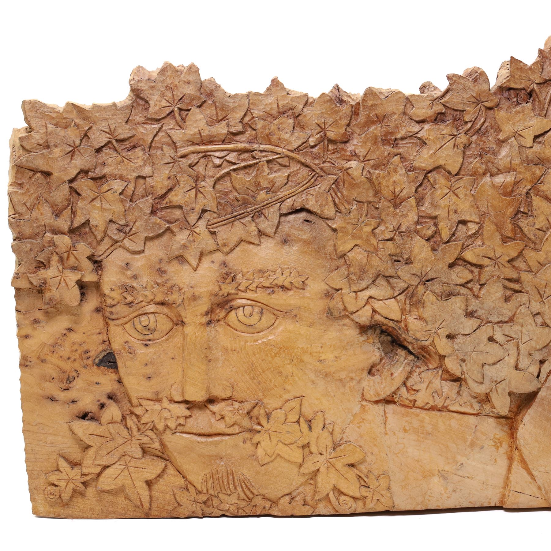 Ian Thompson (British 1947-): 'Green Man', sculpture carved from a single piece of figured burr elm signed and dated 1999 verso 50cm x 103cm