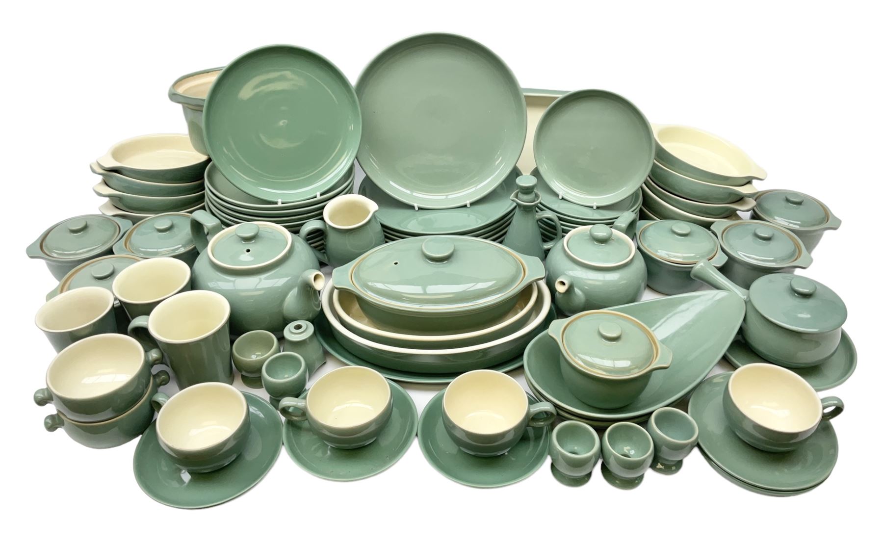 Denby Manor Green pattern part tea and dinner service, to include seven dinner plates, thirteen side plates, ten dessert plates, two oval dishes of various sizes, four cups and saucers, seven bowls with covers, two teapots etc (74)  