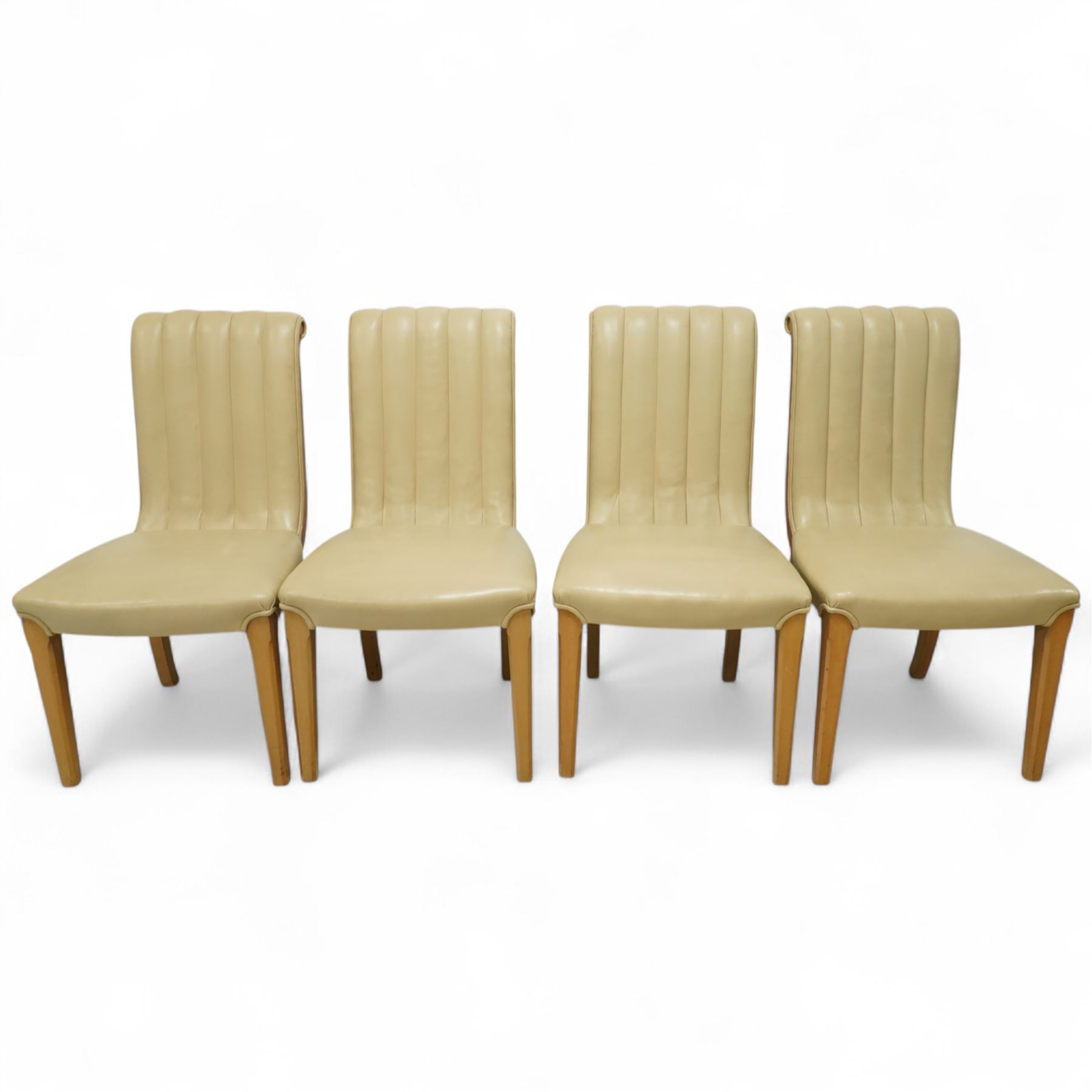 In the manner of Harry & Lou Epstein - Art Deco figured walnut veneered dining table, rectangular top with canted corners and glass protective top, edge with gently canted profile, on two rounded drum-shaped pedestals together with a set of four mid-century style walnut chairs, with elegant scroll and walnut veneered backs, upholstered in a light cream leather, 54x44x96cm