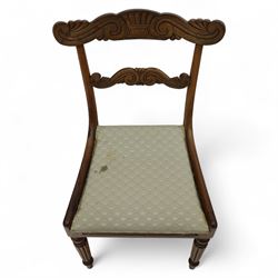 Set of four 19th-century rosewood dining chairs in the William IV style, shaped and carved top rail with fan and scroll decoration above a upholstered padded seat on reeded and turned front legs 