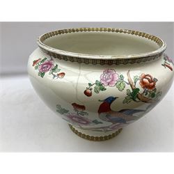 Large ceramic Jardiniere on stand, decorated with an oriental pheasant perched upon branches blossoming with peonies and foliage on white ground, overall H99cm