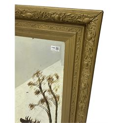 Late 19th century gilt framed wall mirror, the frame decorated with trailing foliage and thistles, bevelled mirror plate hand painted with stag in woodland 
