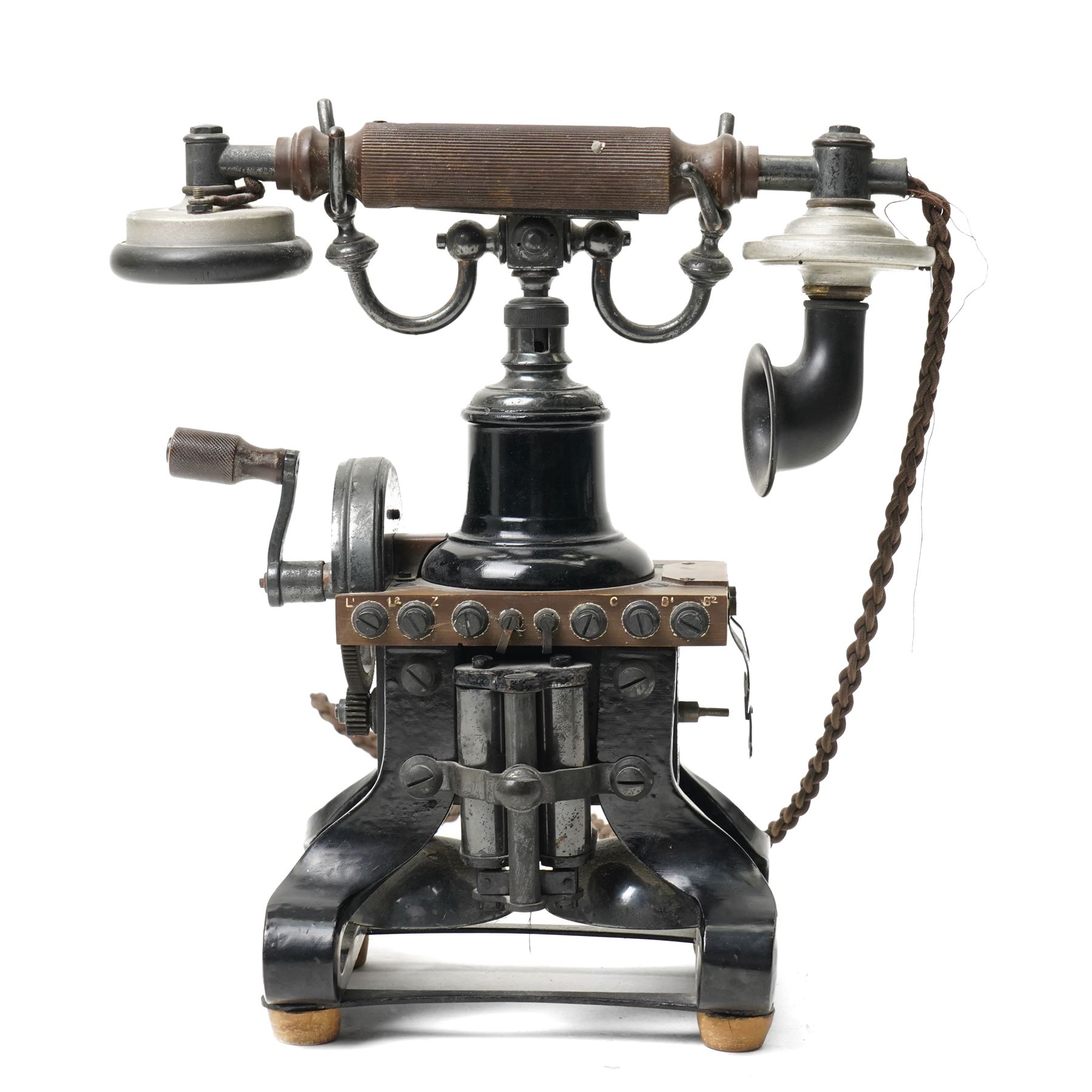 Early 20th century L M Ericsson & Co Skeletal table telephone, the earpiece impressed No.28, with black painted frame and possibly original wires, H29cm